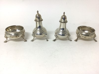 Lot 135 - Sterling silver four-piece cruet set, London 1957 and 1968, with hoof feet