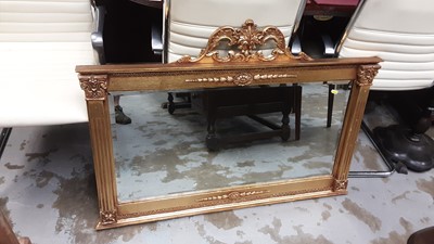 Lot 1011 - Georgian style giltwood overmantel mirror with bevelled mirrored glass flanked by Corinthian pilasters