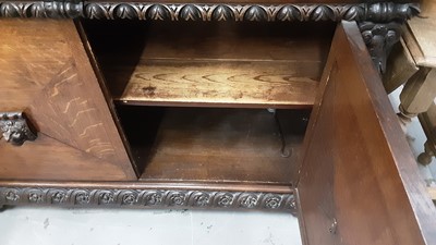 Lot 948 - Late Victorian carved oak sideboard with two frieze drawers and cupboards below with carved lions head handles, 132cm wide, 54.5cm deep, 105cm high