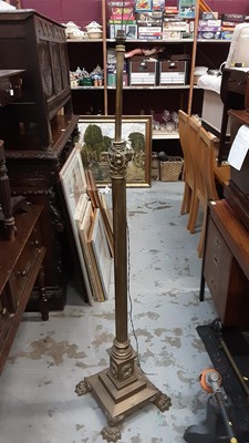 Lot 951 - Late Victorian brass corinthian column standard lamp converted to electricity on paw feet