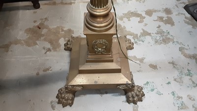 Lot 951 - Late Victorian brass corinthian column standard lamp converted to electricity on paw feet