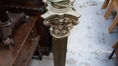 Lot 951 - Late Victorian brass corinthian column standard lamp converted to electricity on paw feet