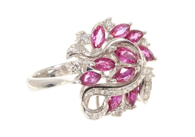 Lot 580 - Ruby and diamond cocktail ring with eleven marquise cut rubies estimated to weigh approximately 2.29cts in total, with brilliant cut and single cutdiamonds estimated to weigh approximately 0.41cts,...