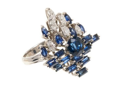 Lot 579 - Sapphire and diamond cluster cocktail ring with mixed cut blue sapphires and six marquise cut diamonds in white gold setting