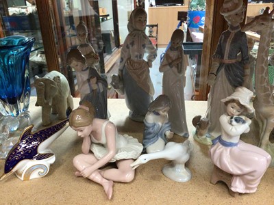 Lot 311 - Collection of figure and animal ornaments including Lladro swan, NAO seated girl with a puppy, Royal Crown Derby dolphin paperweight, Swarovski and other items