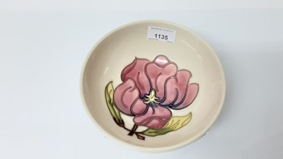 Lot 1135 - Moorcroft pottery bowl decorated with pink flowers on cream ground