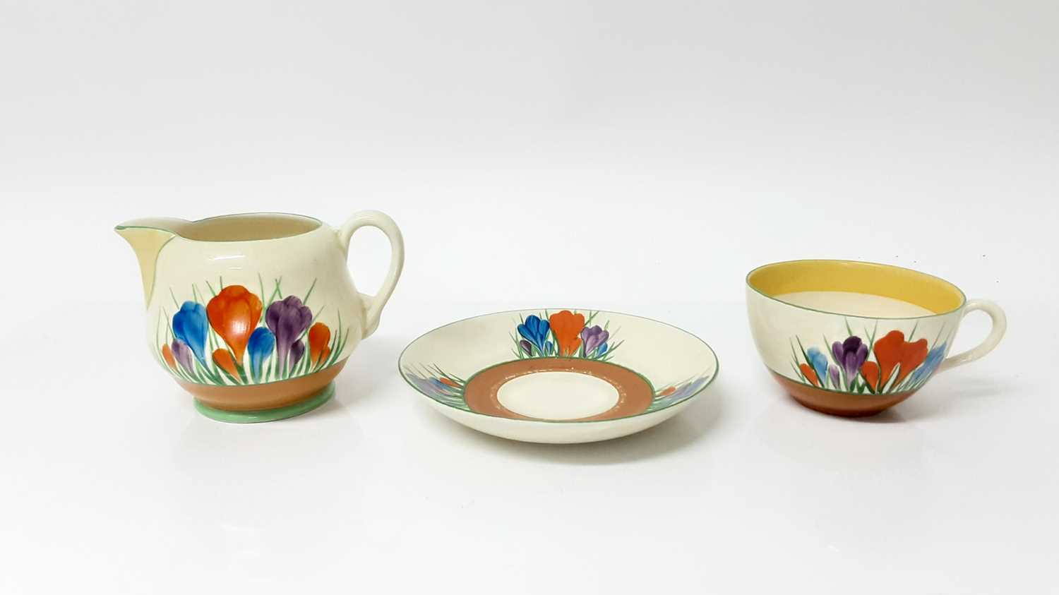 Lot 1133 - Clarice Cliff Crocus pattern cupp, saucer and milk jug