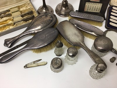 Lot 201 - Quantity of silver, including knives, brushes, toiletry jars, desk calendar, etc