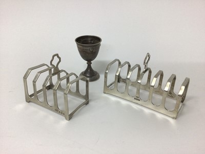 Lot 202 - Two silver toast racks, Birmingham 1933 and Sheffield 1954, and a continental silver egg cup