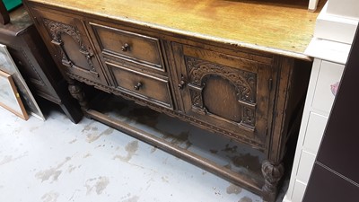 Lot 990 - Good quality carved oak sideboard with two central drawers flanked by carved panelled doors on cup and cover supports joined by stretchers, 138cm wide, 44.5cm deep, 86cm high