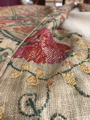 Lot 2081 - 19th century Suzani textile worked in panels and re-stitched together. Hand stitched silk thread embroidery over drawn pattern on linen foundation cloth. Traditional floral design.