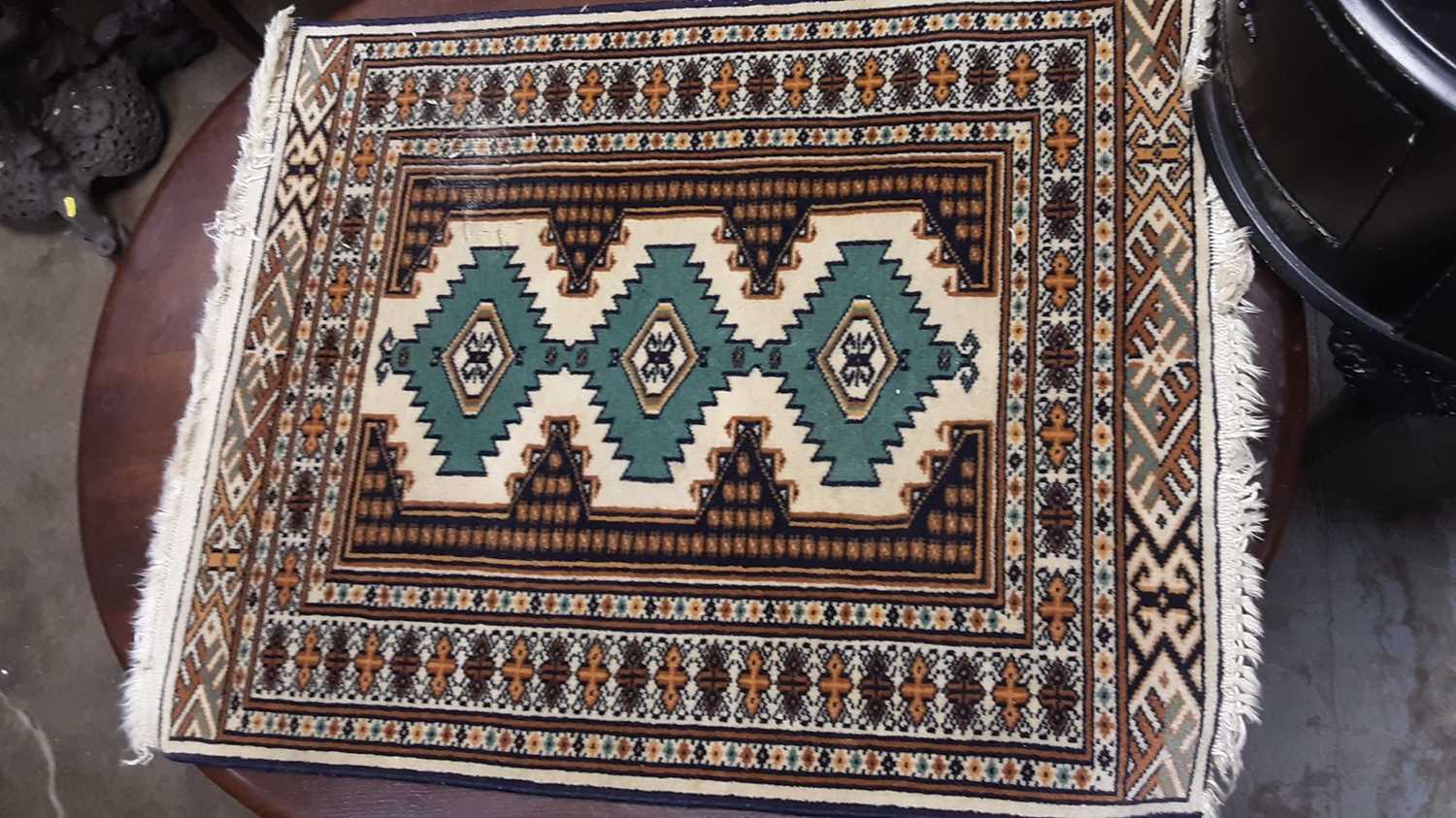 Lot 1001 - Two small Eastern rugs with geometric decoration, 80cm x 64.5cm