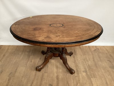 Lot 1010 - Victorian inlaid walnut oval loo table on four turned column supports and four carved splayed legs, 120cm x 87cm