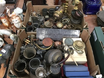 Lot 407 - Two boxes of mixed metalware to include pewter tankards, brass candlesticks and other items