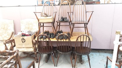 Lot 1049 - Ercol dining table together with six stick back chairs comprising four standards and two carvers