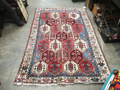 Lot 1062 - Eastern rug with geometric decoration on blue, red and cream ground, 203cm x 128cm