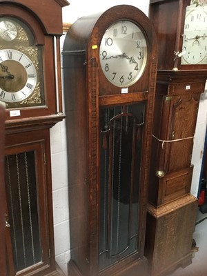 Lot 1074 - 1930's oak long case clock with glazed door