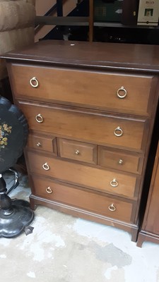 Lot 1087 - Stag bedroom suite comprising double wardrobe, bedside chest with single drawer, and a chest of three short and four long drawers (3)