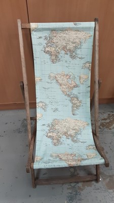 Lot 643 - Two vintage fabric deck chairs, one with map decoration