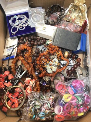 Lot 716 - Group costume jewellery including raw amber bead necklaces, coral, silver locket and bijouterie