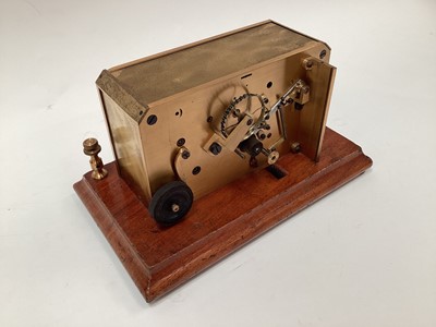 Lot 2444 - Rare early 20th century brass ticker tape machine on mahogany base