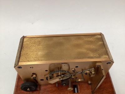 Lot 2444 - Rare early 20th century brass ticker tape machine on mahogany base