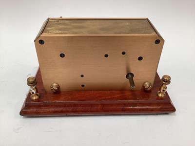 Lot 2444 - Rare early 20th century brass ticker tape machine on mahogany base