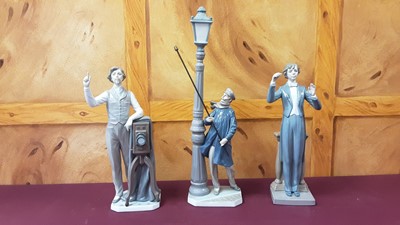 Lot 1239 - Three large Lladro figures - man lighting a street light, photographer