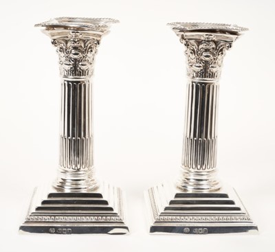 Lot 401 - Pair of Edwardian 6" Corinthian column candlesticks