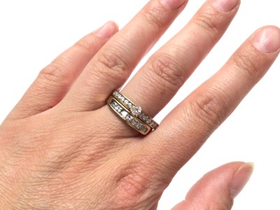 Lot 25 - 9ct gold diamond single stone ring with diamond set shoulders and 9ct gold synthetic white stone half eternity ring (2)
