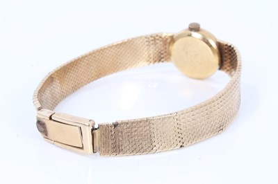 Lot 660 - Ladies Omega 9ct gold wristwatch on integral gold milanese bracelet
