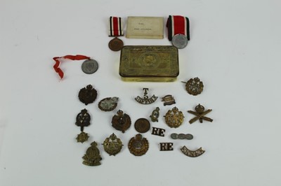 Lot 716 - First World War Princess Mary Gift Tin, together with RAF, Royal Engineers, and other cap badges together with a George V Special Constabulary Long Service medal named to Frank Riddleston.