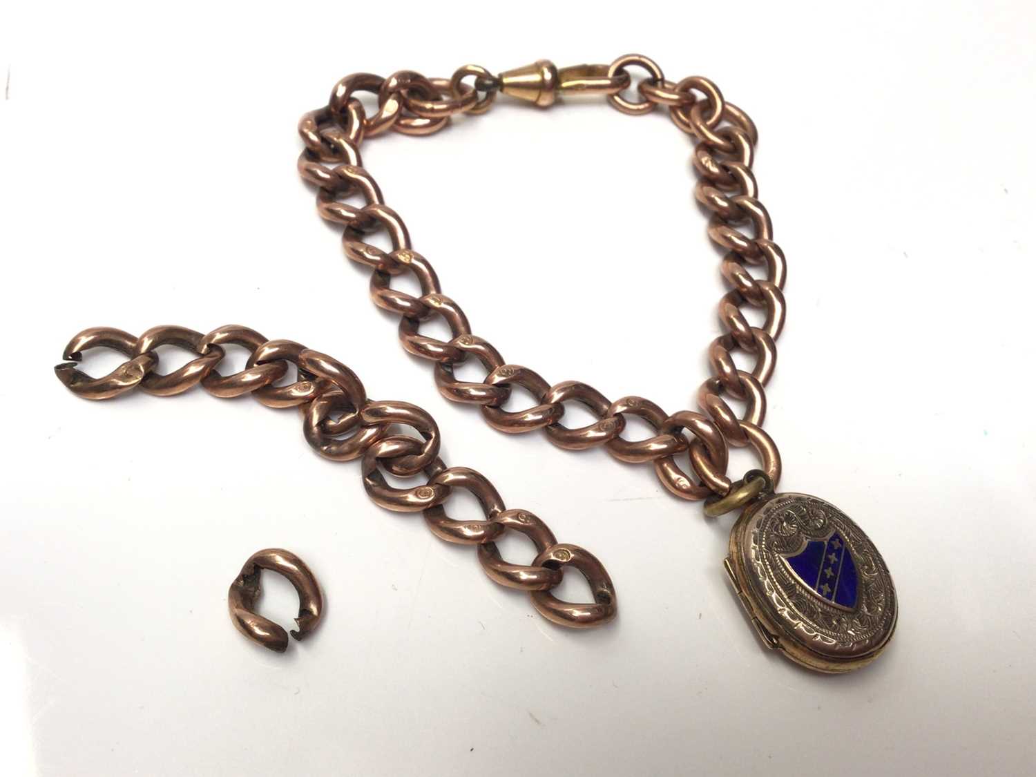 Lot 51 - Victorian 9ct rose gold link chain with gilt metal enamelled locket fob