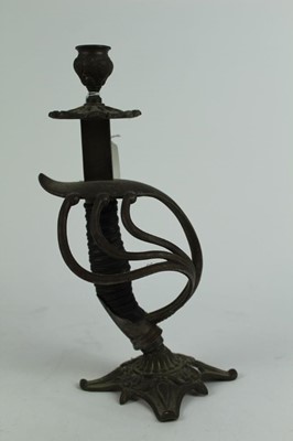 Lot 726 - Interesting brass candlestick constructed from an Imperial German sword hilt, 28.5cm in overall height