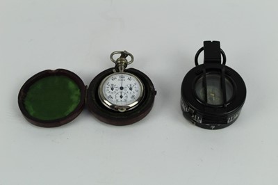 Lot 736 - Second World War British Military MKIII prismatic compass dated 1943 and stamped TG. Co. Ltd, No.B 274057, together with an unusual combination stop watch / compass (2).