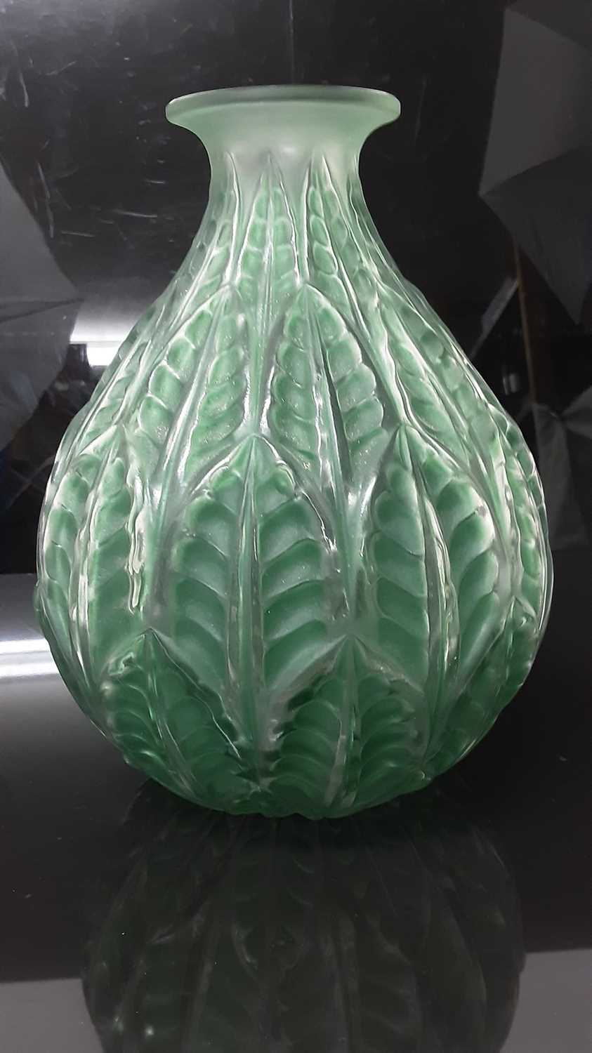 Lot 1000 - Rene Lalique Malesherbes pattern vase in emerald green, signed on base, 23cm high