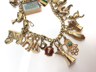 Lot 76 - 18ct gold charm bracelet with various 18ct, 14ct and 9ct gold charms