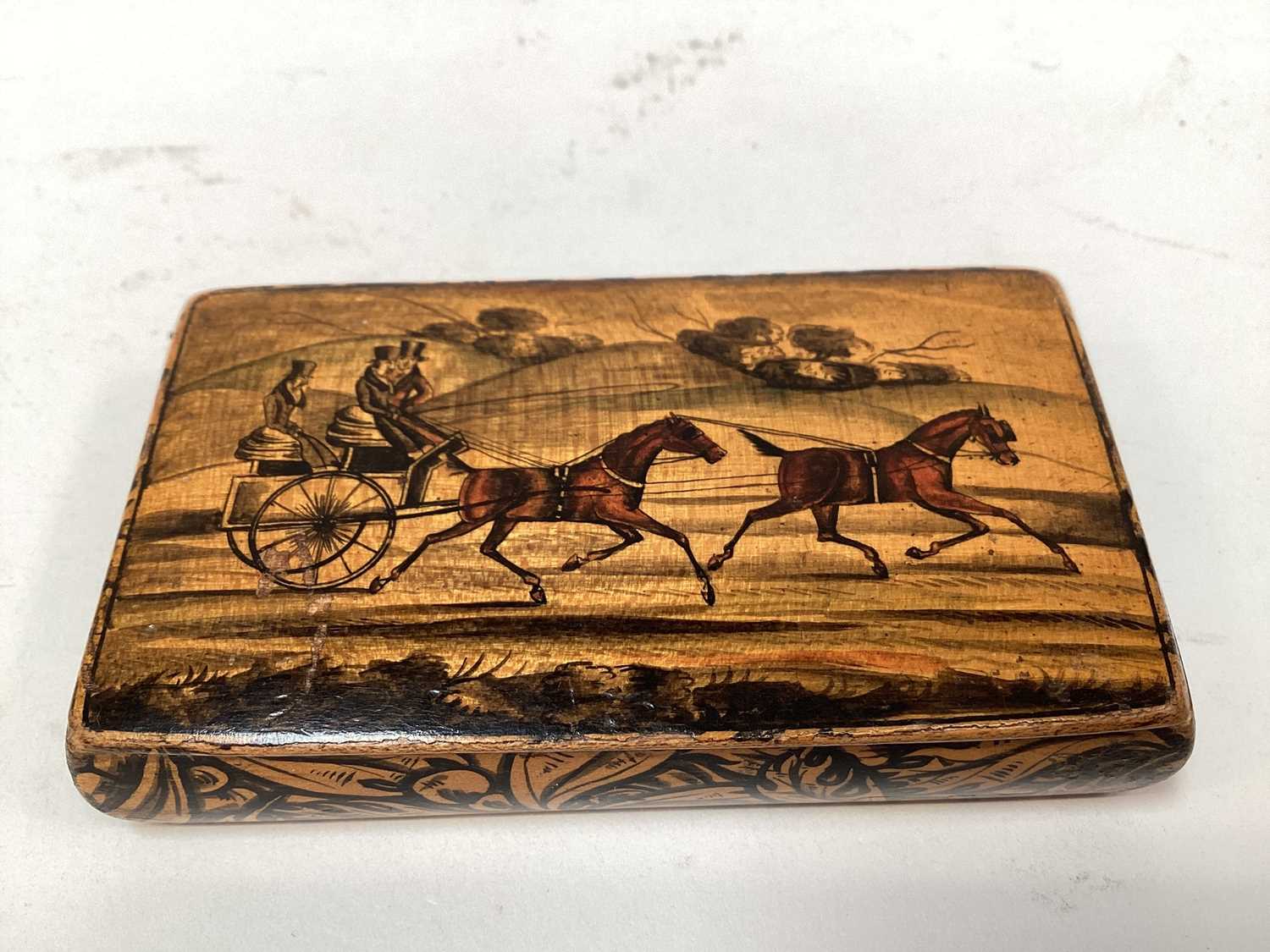 Lot 2469 - Rare Victorian Mauchline ware snuff box, with a penwork carriage driving scene, the outside with foliate patterns, 8.5cm across