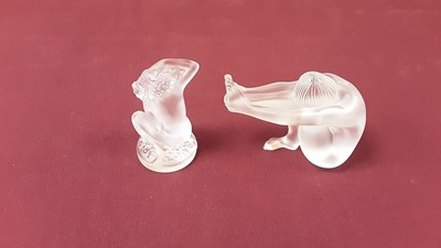 Lot 1016 - Lalique Floreal glass figure of a kneeling nude female, 8cm high, together with another Lalique glass nude female figure, both signed Lalique France (2)