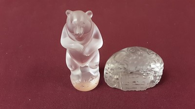 Lot 1017 - R.Lalique glass menu holder, together with a Lalique glass model of a performing bear, 7.5cm high, both signed (2)