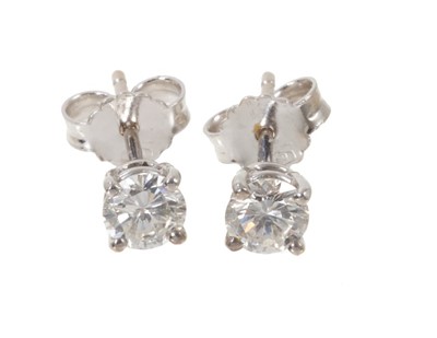 Lot 555 - Pair of diamond stud earrings