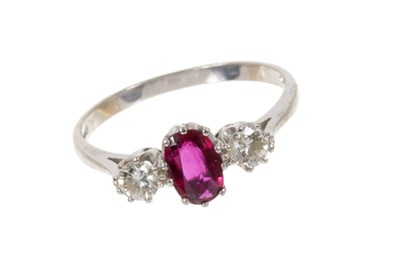 Lot 553 - Ruby and diamond three stone ring