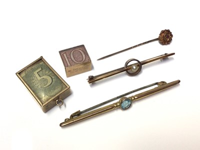 Lot 150 - 18ct gold pearl bar brooch, 9ct gold bar brooch, Victorian stick pin and two 9ct gold mounted glazed charms containing bank notes