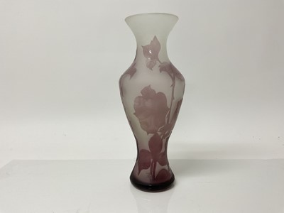 Lot 1032 - Cameo glass vase with floral decoration on purple ground, unsigned, 25cm high