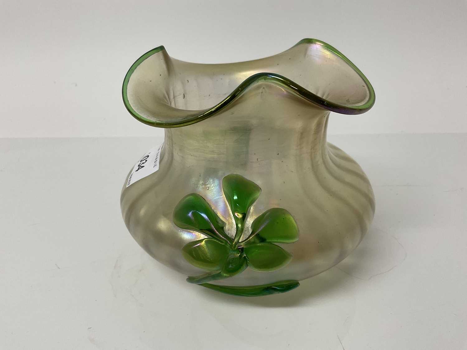 Lot 1318 - Loetz style Kralik iridescent glass vase decorated with a green flower, 11cm high