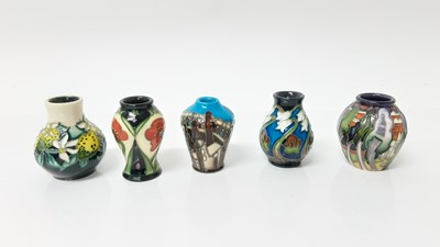 Lot 1043 - Five Moorcroft miniature vases in different patterns, all with impressed marks to base