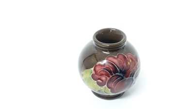 Lot 1044 - Eight Moorcroft miniature vases, various patterns, together with a Moorcroft Macintyre vase