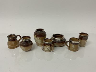 Lot 1047 - Seven Doulton miniature stoneware items including jugs, tyg, vase, beaker etc all decorated with hunting, drinking and smoking scenes, all with silver rims