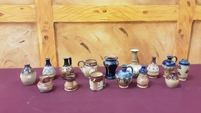 Lot 1049 - Collection of miniature Doulton stoneware including vases, ewers, jugs etc (46)