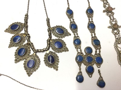 Lot 96 - Three Eastern white metal necklaces set with lapis lazuli, agate necklace, Egyptian necklace and a box
